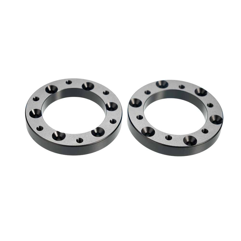 Black circular extension adapters for Simagic Alpha EVO sim racing setup