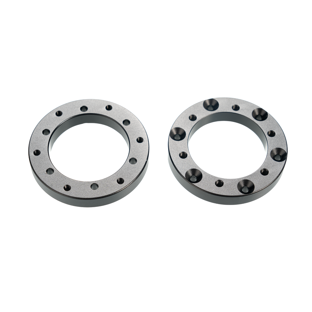 Black circular extension adapters for Simagic Alpha EVO sim racing setup