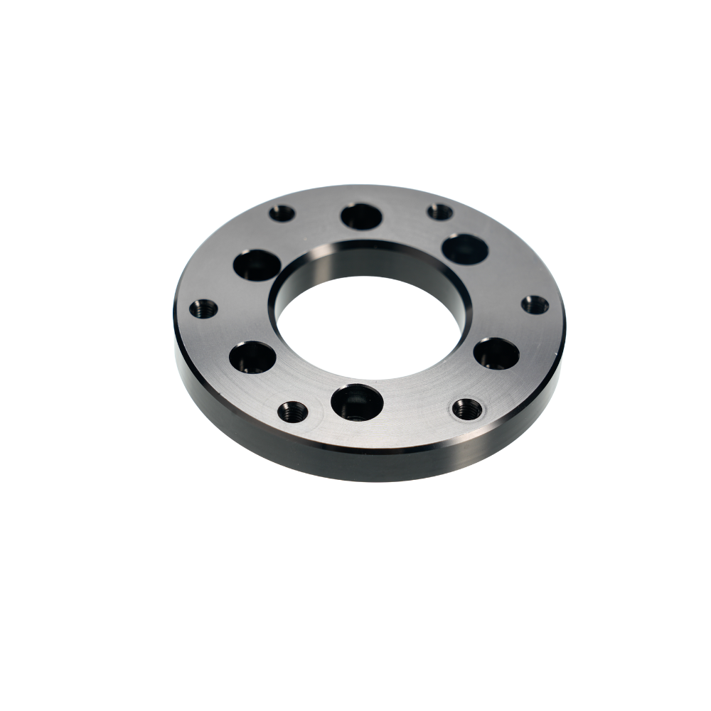 Universal 58mm to 70mm PCD wheel adapter with metallic circular design