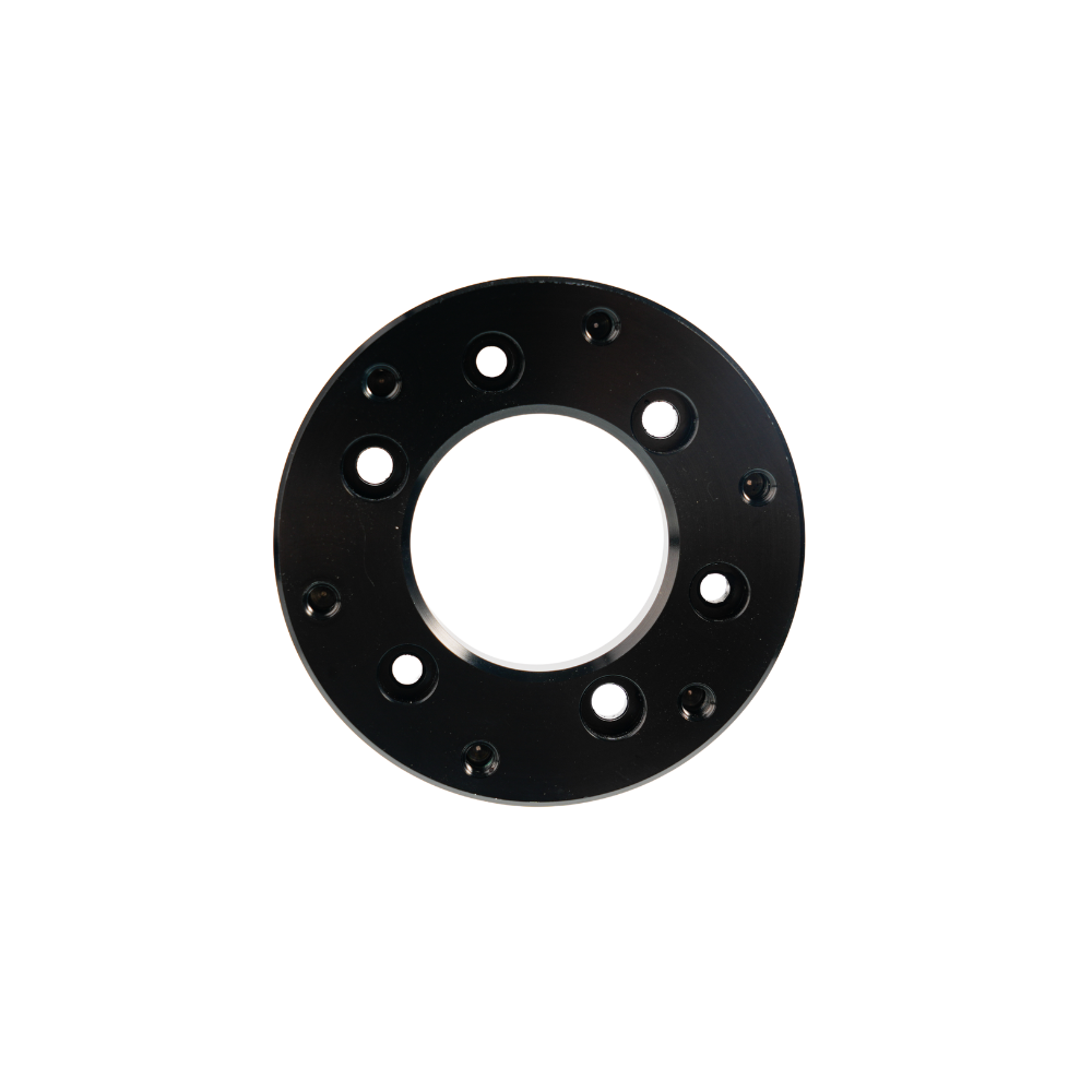 Black circular sim racing wheel adapter with multiple mounting holes