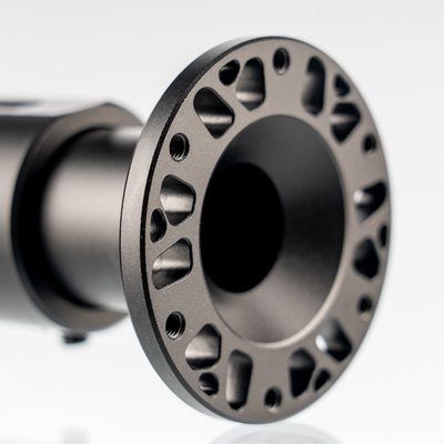 Close-up of adjustable shaft extension's perforated metal end with mounting holes