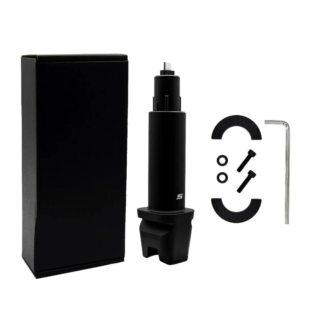 Black mechanical component with packaging and tools on a white background