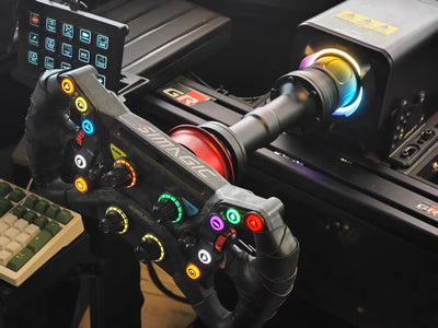 Simagic Alpha EVO extension adapter mounted on racing wheel setup