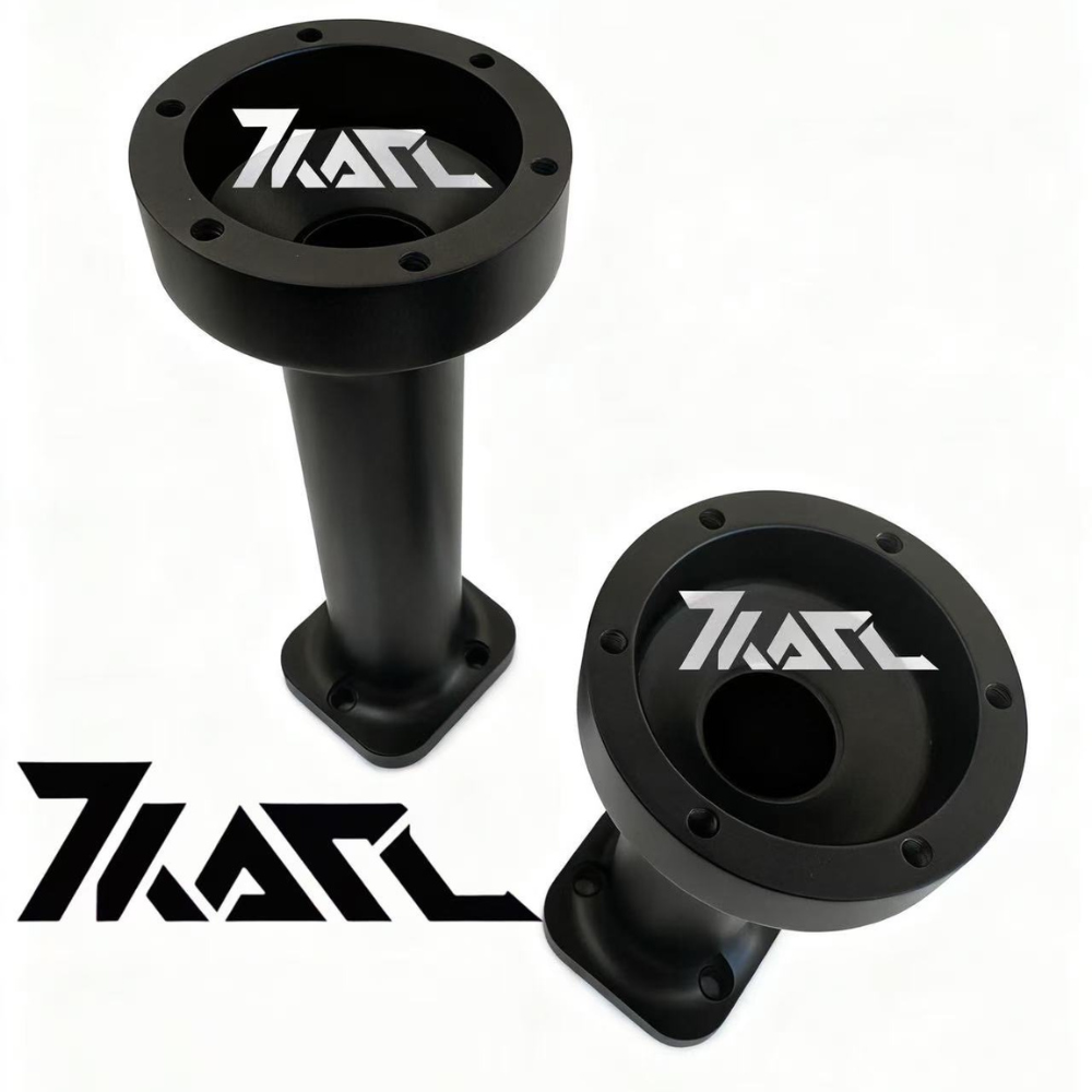 Two black anodized aluminum KARL Extenders for Simucube 3, cylindrical with mounting holes and branded logo, designed for sim racing setups.