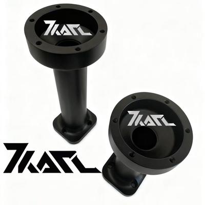 Two black anodized aluminum KARL Extenders for Simucube 3, cylindrical with mounting holes and branded logo, designed for sim racing setups.
