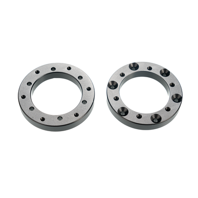 Black circular extension adapters for Simagic Alpha EVO sim racing setup