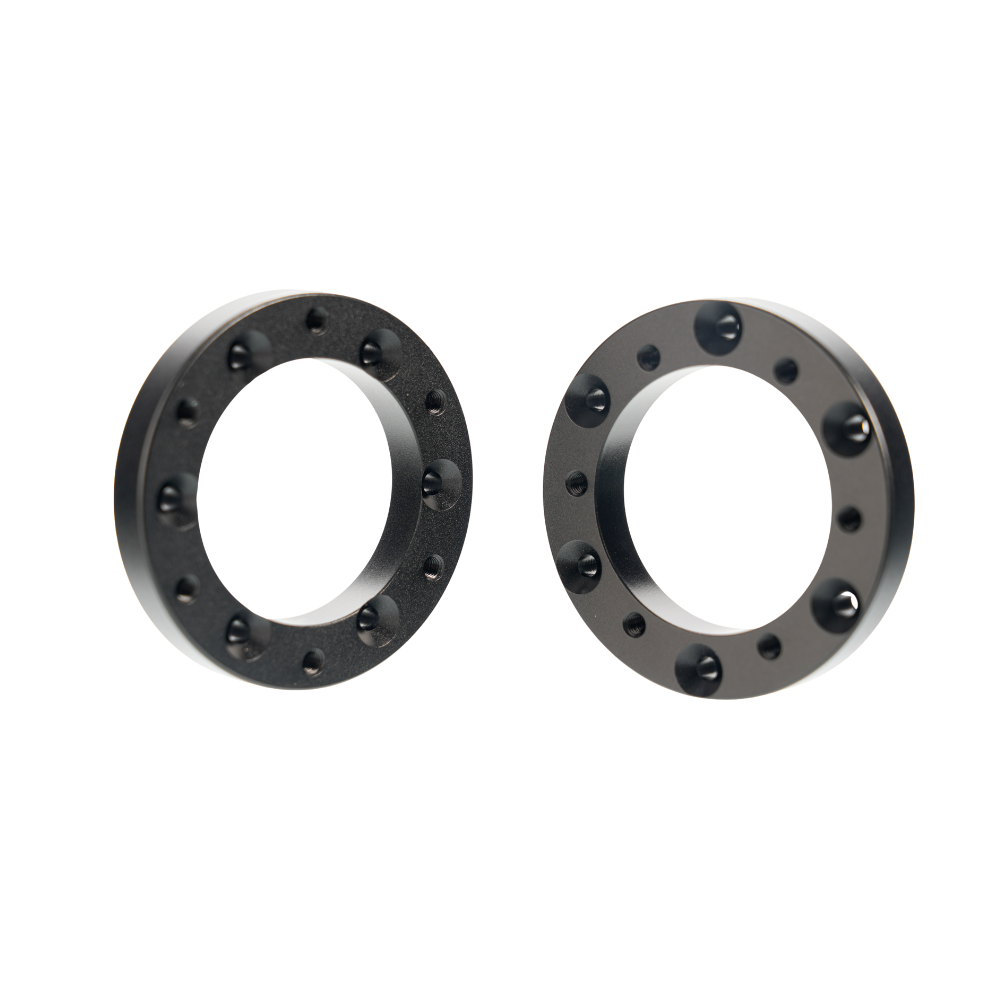 Black circular extension adapters for Simagic Alpha EVO sim racing setup
