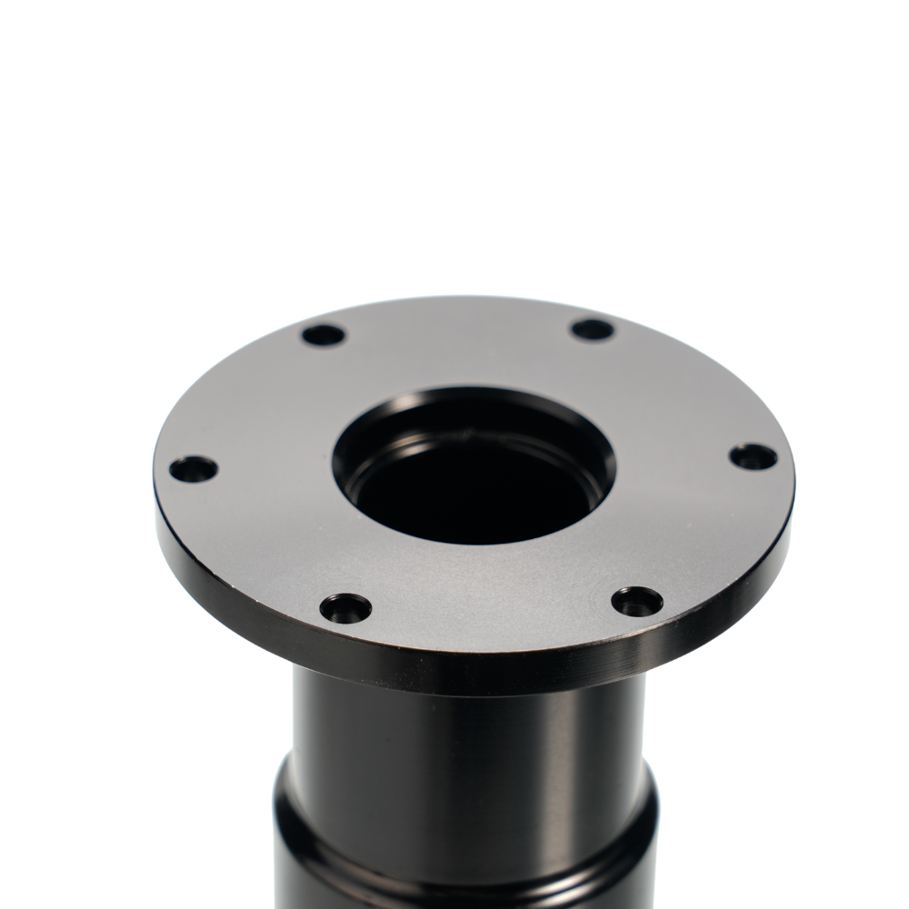 Close-up of black shaft extension flange with mounting holes