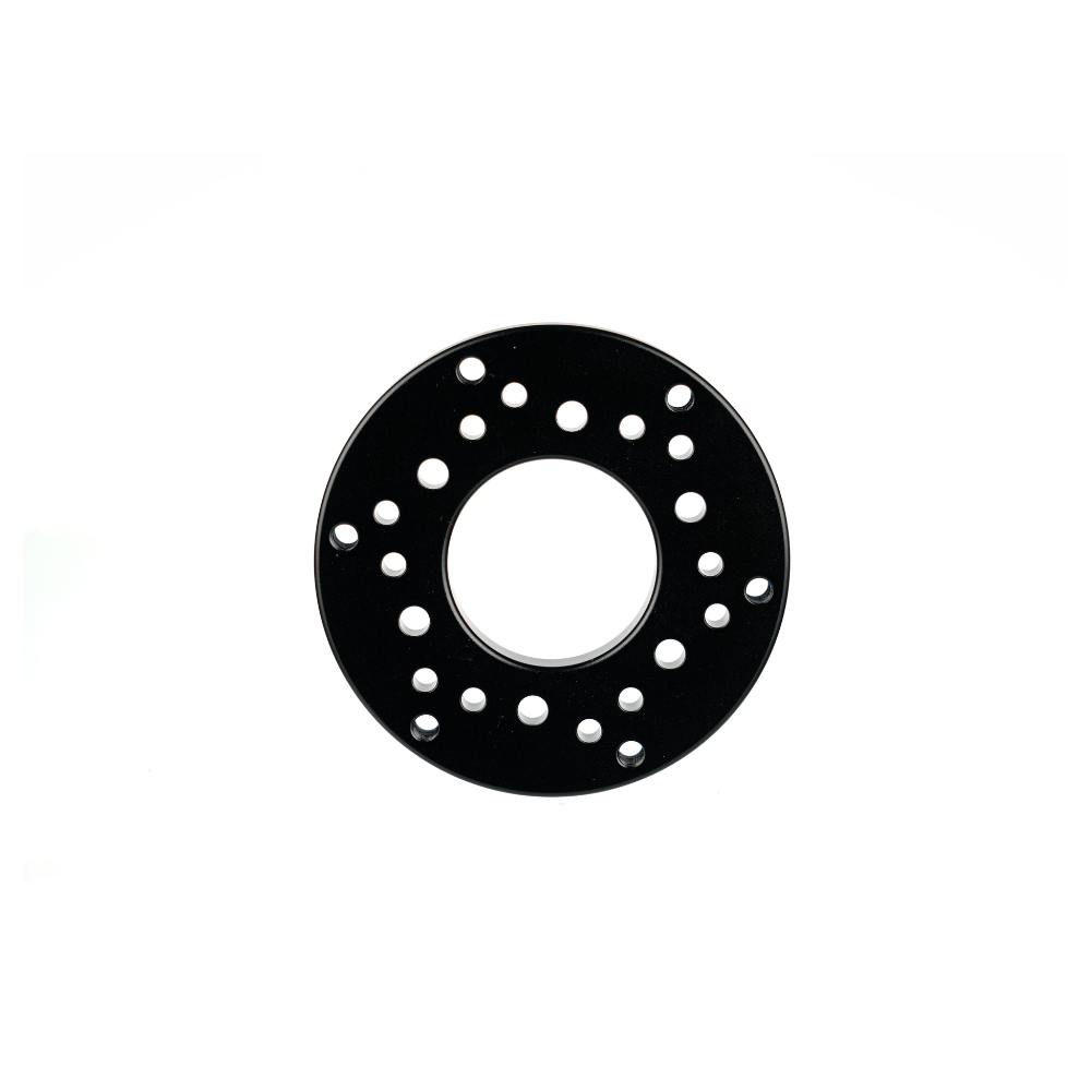 Black 70mm PCD adapter with circular design and evenly spaced holes for sim racing accessories